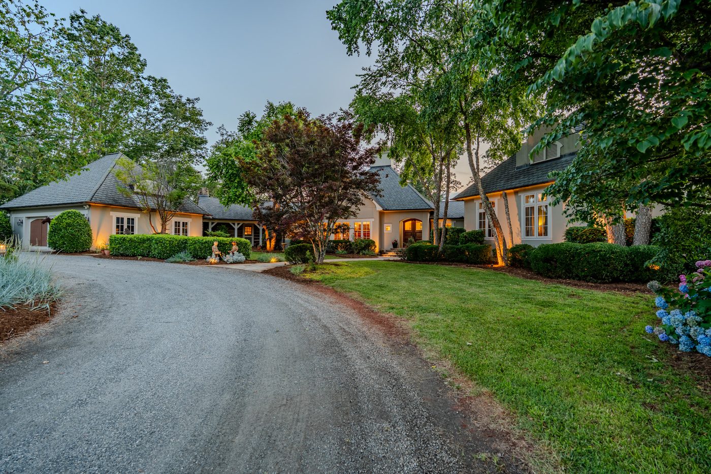 Hidden Hollow Farm, the house lit at dusk
